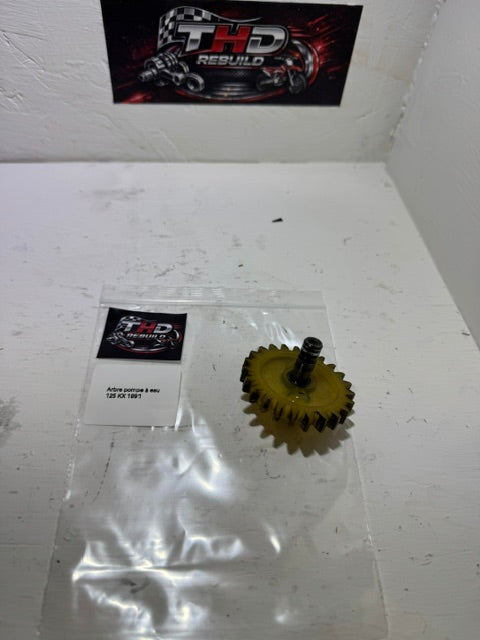 Arbre de pompe a eau OEM KAWASAKI 125 KX 1990 à 1991 référence 132341094 Occasion