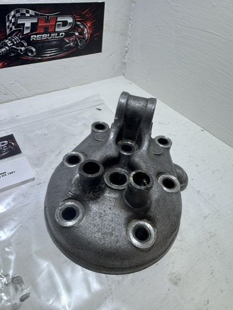Culasse OEM KAWASAKI 125 KX 1990 à 1991 référence 110011344 Occasion